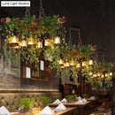 DecorBites™ Industrial Black Metal Lantern Island Light - 8-Lights Hanging Lamp with Plant Decoration