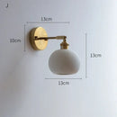 Ribbed white glass and brass ceramic wall sconce for bedroom lighting