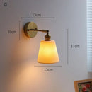 Ribbed white glass and brass ceramic wall sconce for bedroom lighting