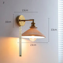 Ribbed white glass and brass ceramic wall sconce for bedroom lighting