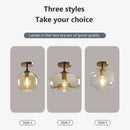 Modern brass and amber glass ceiling light for living room