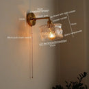 Green ribbed glass wall sconce with pull chain switch for bedroom