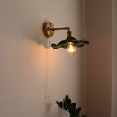Green ribbed glass wall sconce with pull chain switch for bedroom