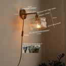 Green ribbed glass wall sconce with pull chain switch for bedroom
