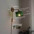 Green ribbed glass wall sconce with pull chain switch for bedroom