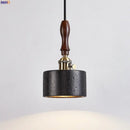 Black travertine cylindrical pendant light for dining room