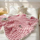 Pink faux rabbit fur chunky knit blanket with pom poms bedroom throw