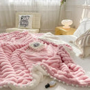 Pink faux rabbit fur chunky knit blanket with pom poms bedroom throw