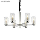 DecorBites™ Modern 6-Head Clear Glass Candle Chandelier: Chrome Ceiling Pendant Fixture with Adjustable Chain