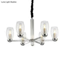 DecorBites™ Modern 6-Head Clear Glass Candle Chandelier: Chrome Ceiling Pendant Fixture with Adjustable Chain