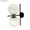 Modern black and white spherical wall light fixture living room