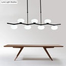 DecorBites™ Modern Black Wavy Pendant Light - 7-Light White Glass Ceiling Island Lamp with Extendable Rods