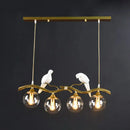 Modern bird branch island pendant light – dining room amber glass