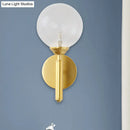 Modern brass glass sphere wall lamp fixture bedroom