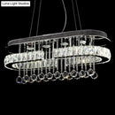 DecorBites™ Modern LED Crystal Pendant Light with Stainless Steel Frame and Tassel Accents