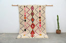 Handmade beige azilal rug with geometric patterns for living room