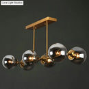 DecorBites™ Postmodern Brass Island Light with Globe Glass Shade: Stylish Metal Ceiling Fixture