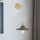 Industrial smoked glass brass sconce light for bedroom