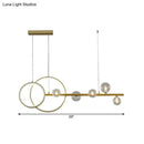 Modern gold ring ceiling light with clear glass sphere dining room