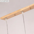 Minimalist wood island pendant light with opaline glass dining room