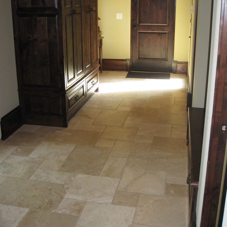 Denizli Beige Antique Pattern Travertine Tile - Full Truckload brushed chiseled installed floor with brown furniture and wooden doors and closet