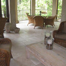 Denizli Beige Antique Pattern Travertine Tile - Full Truckload brushed and chiseled installed balcony floor with rattan dining table with glass top and wooden coffee table