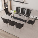 Table and chair set.Elegant Transparent Tempered Glass Dining Set - 71'x35.4' with 8 Black PU Chairs with a vertical stripe design on the backrest.