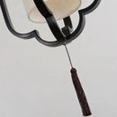 Elegant black wrought iron wall sconce lamp with tassel bedroom light