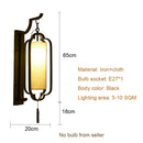 Elegant black wrought iron wall sconce lamp with tassel bedroom light