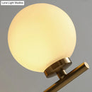 Elegant gold and ivory glass wall sconce for bedroom light