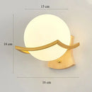 Elegant gold iron wall lamp with frosted glass shade for bedroom