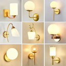 Elegant gold iron wall lamp with frosted glass shade for bedroom