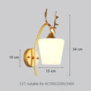 Elegant gold iron wall lamp with frosted glass shade for bedroom