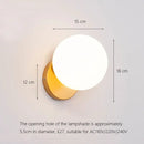Elegant gold iron wall lamp with frosted glass shade for bedroom