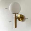 Elegant gold iron wall lamp with frosted glass shade for bedroom