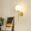 Elegant gold iron wall lamp with frosted glass shade for bedroom