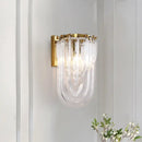 Elegant gold wall lamp with twisted crystal shade for bedroom