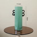 Emerald green glass vase with black handles living room decor