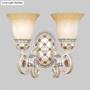 French country gold wall sconce with opaline glass – living room