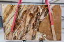 Fusion Gold Bookmatching Marble Slabs Polished - Full Truckload red straps holding it
