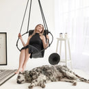Genuine Leather Round Hanging Chair Black Blonde woman with black Dress dog on the floor side table