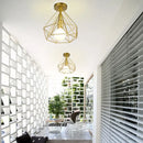 Geometric cage iron ceiling light fixture dining room exposed bulb