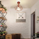Geometric cage iron ceiling light fixture dining room exposed bulb
