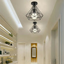 Geometric cage iron ceiling light fixture dining room exposed bulb