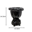 Glossy black ceramic vase with pink artificial flowers bedroom decor