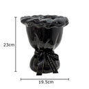 Glossy black ceramic vase with pink artificial flowers bedroom decor