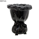 Glossy black ceramic vase with pink artificial flowers bedroom decor