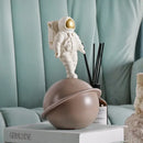 Glossy white and gold astronaut phone holder bedroom decor sculpture