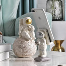 Glossy white and gold astronaut phone holder bedroom decor sculpture