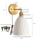 Gold ceramic led wall sconce with ribbed shade for bedroom